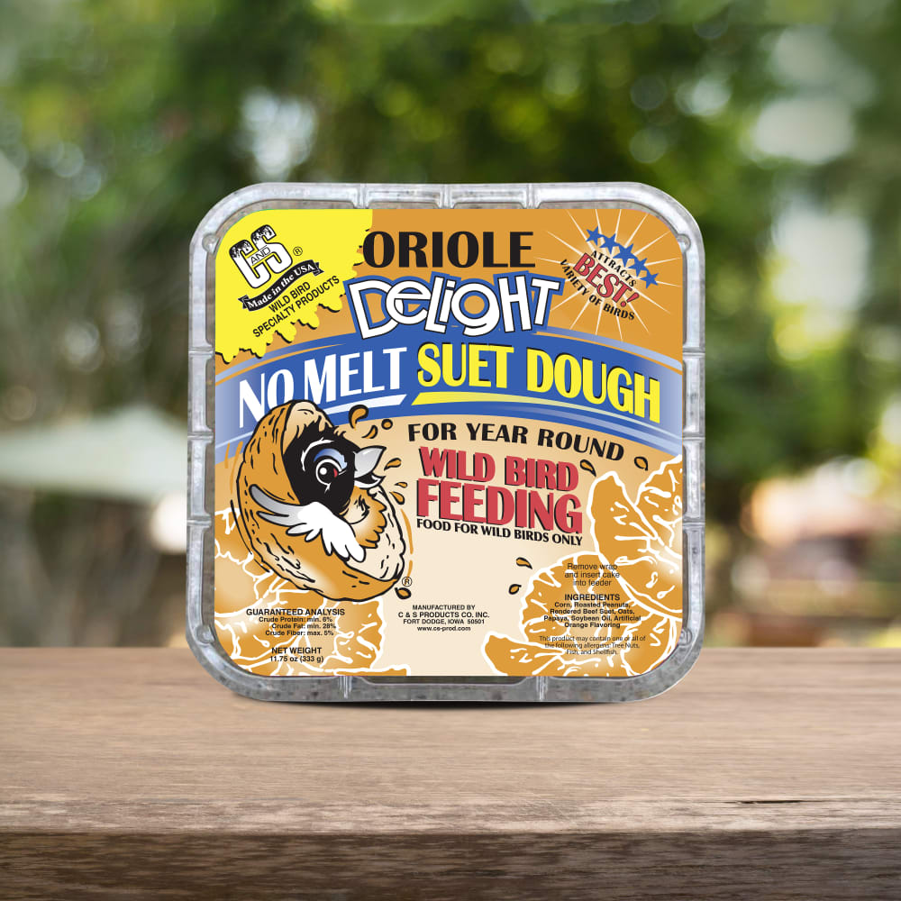 Image of the C&S Oriole Delight No Melt Suet Dough retail packaging on a wooden table