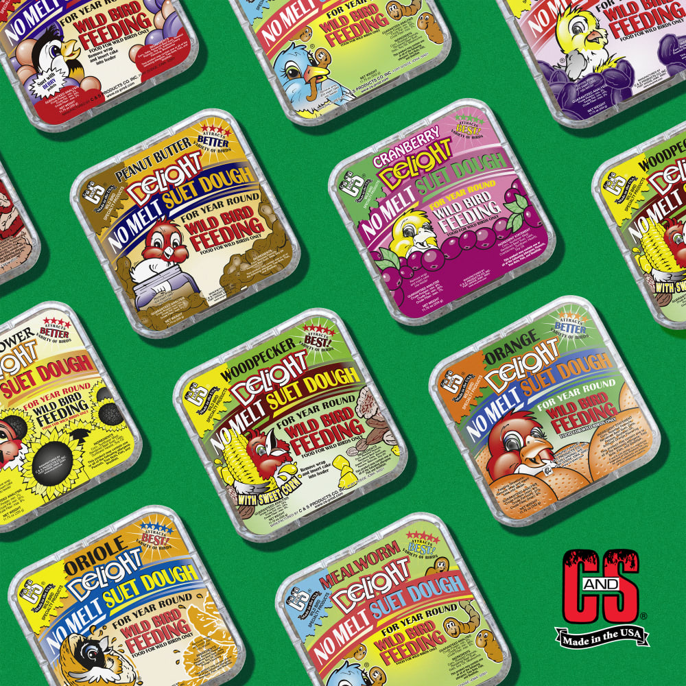 Image of several varieties of suet dough displayed on a green background