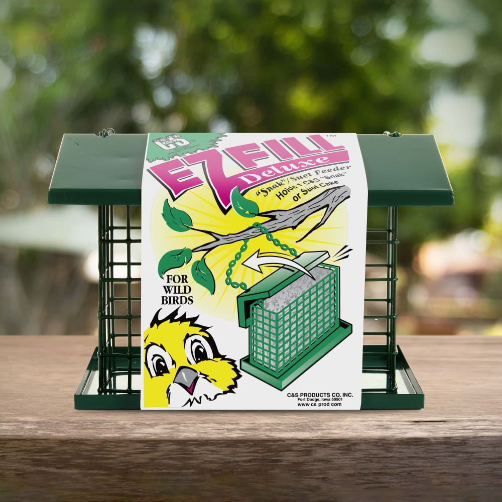 Close-up of C&S EZ Fill Deluxe Suet and Snak Feeder with Roof & Platform sitting on a wooden table